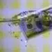 hundred dollar bill floating in water