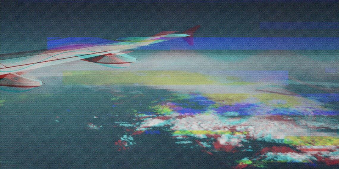 glitchy image of airplane wing mid-flight