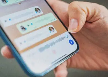person looking at whatsapp thread