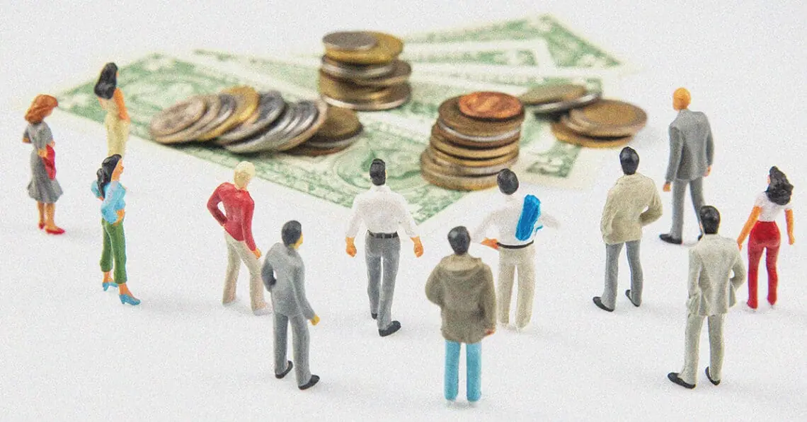 figurines looking at pile of money