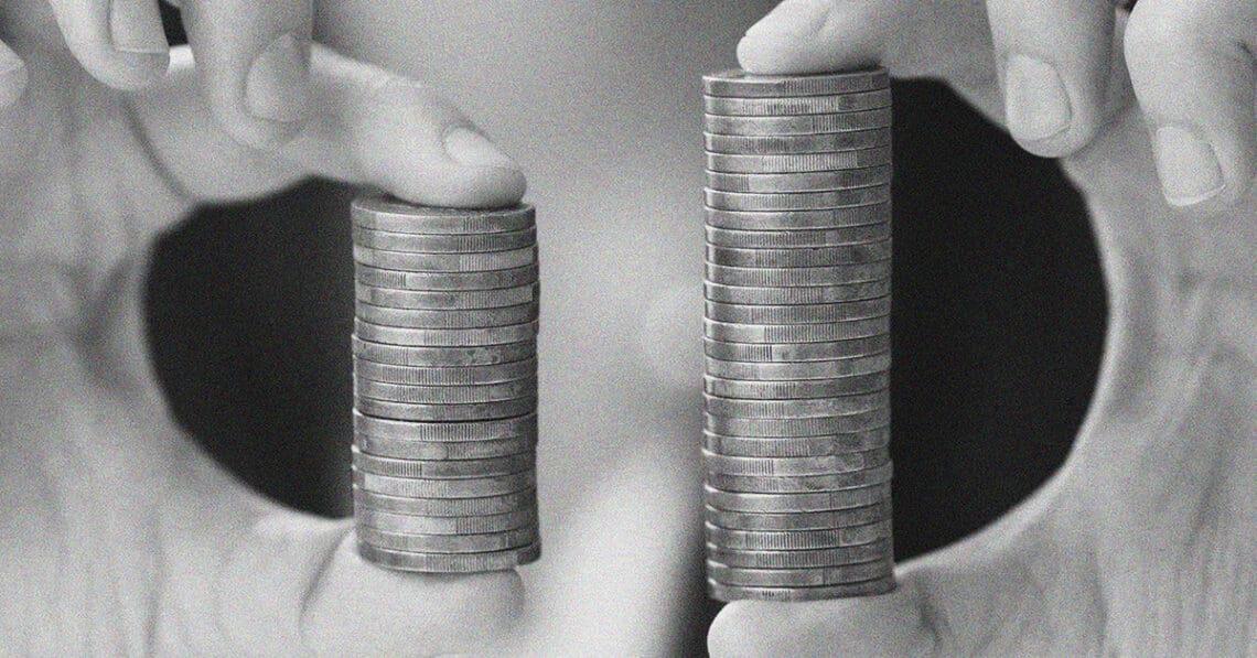 hands with two stacks of coins