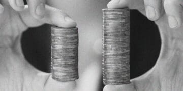 hands with two stacks of coins