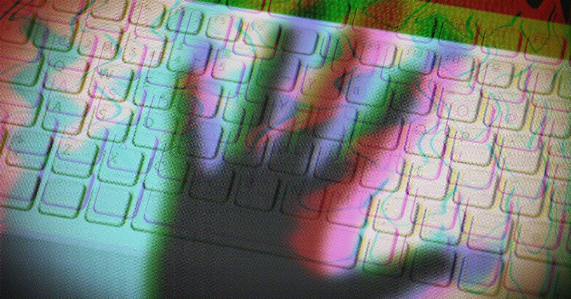 shadow of hand over keyboard