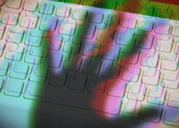 shadow of hand over keyboard