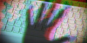 shadow of hand over keyboard