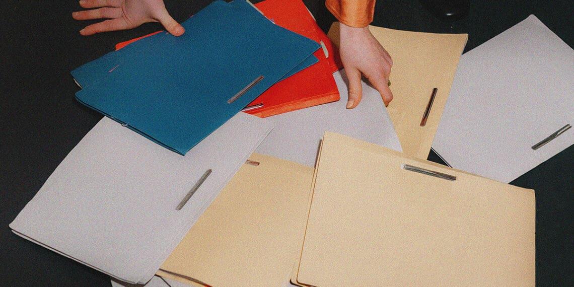 office worker picking up file folders