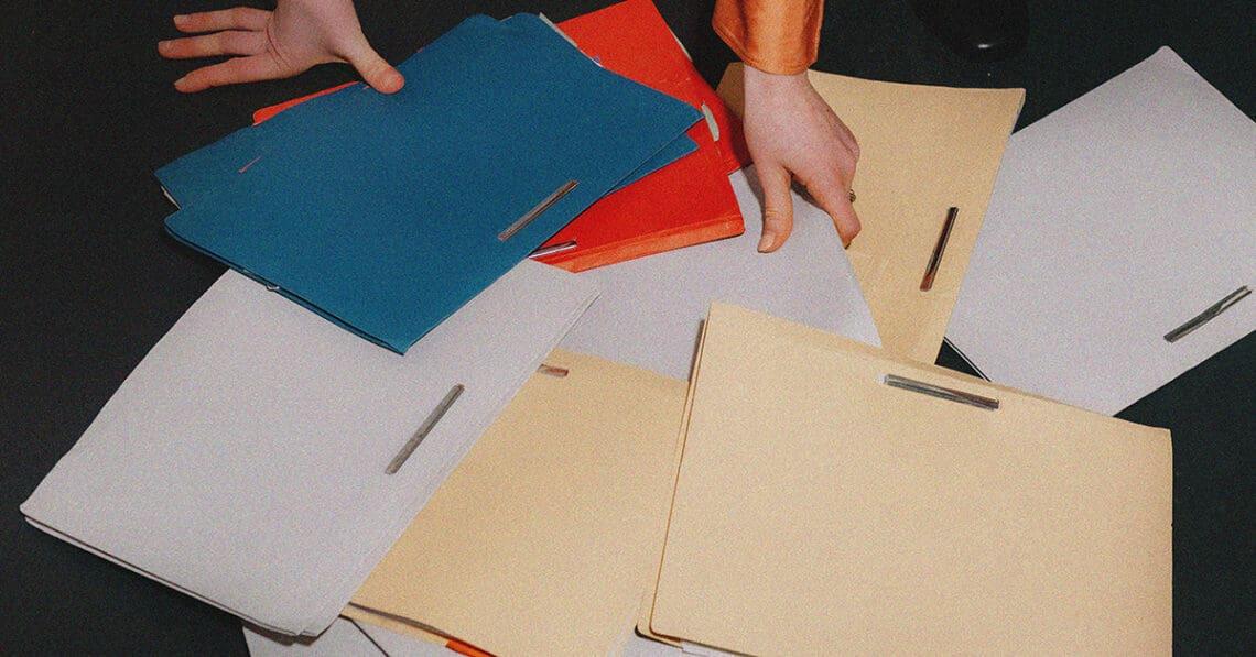 office worker picking up file folders