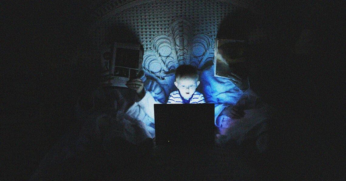 small child using computer