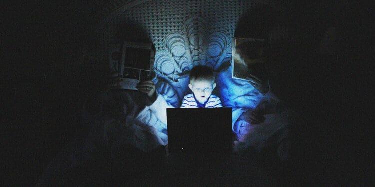 small child using computer