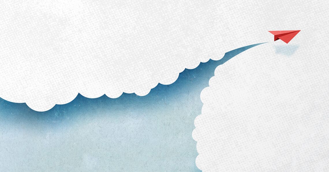 paper airplane cutting through clouds