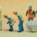 small figurines connecting ethernet cable