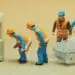 small figurines connecting ethernet cable