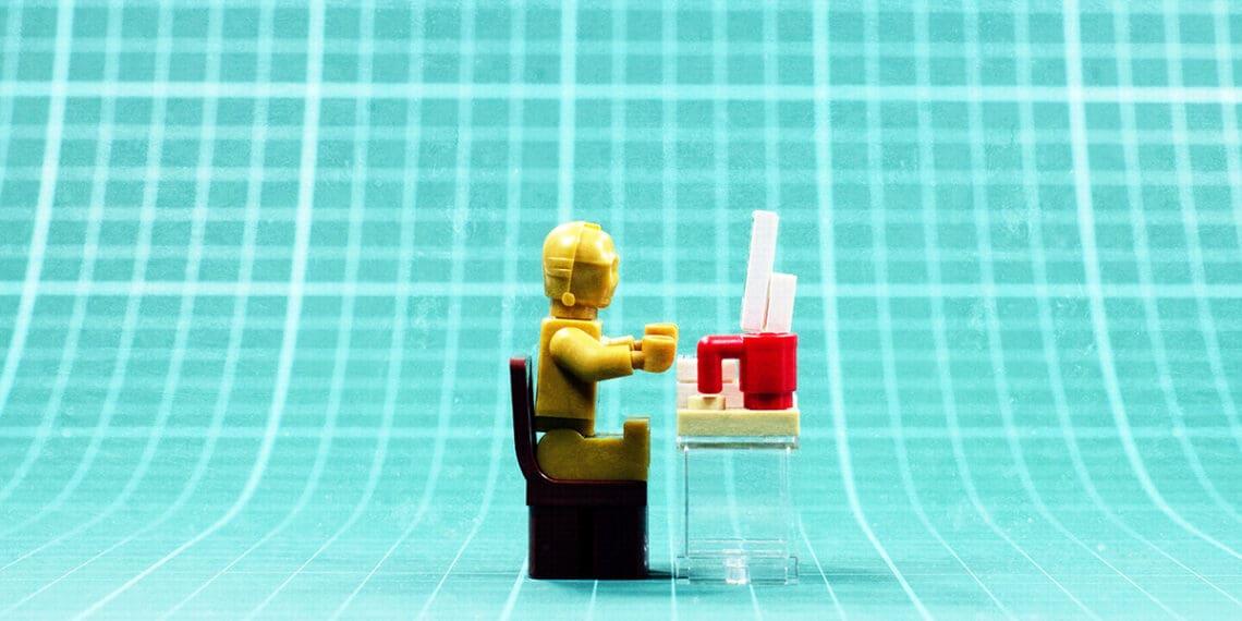 c3po working at a desk