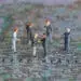political figurines meeting on top of US map