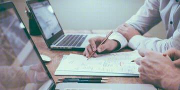 examining data on laptop screen