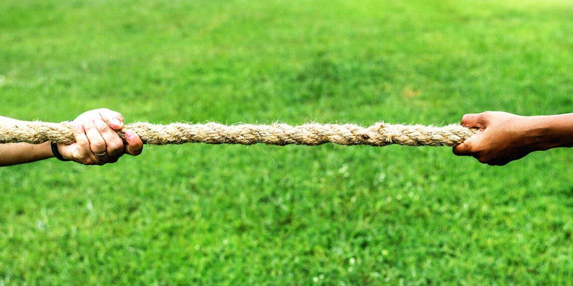 hands firmly holding rope