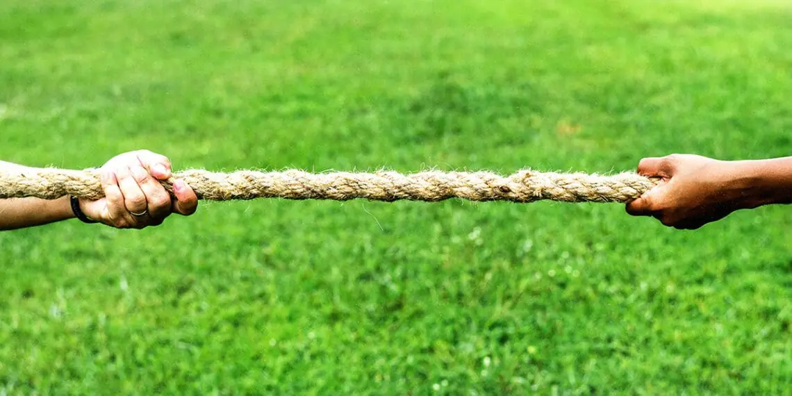 hands firmly holding rope