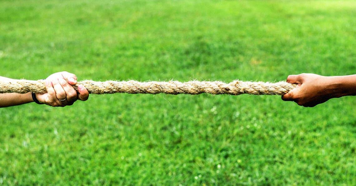 hands firmly holding rope