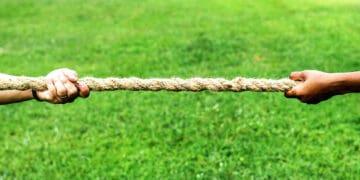 hands firmly holding rope