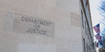 doj building sign with flags