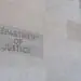 doj building sign with flags
