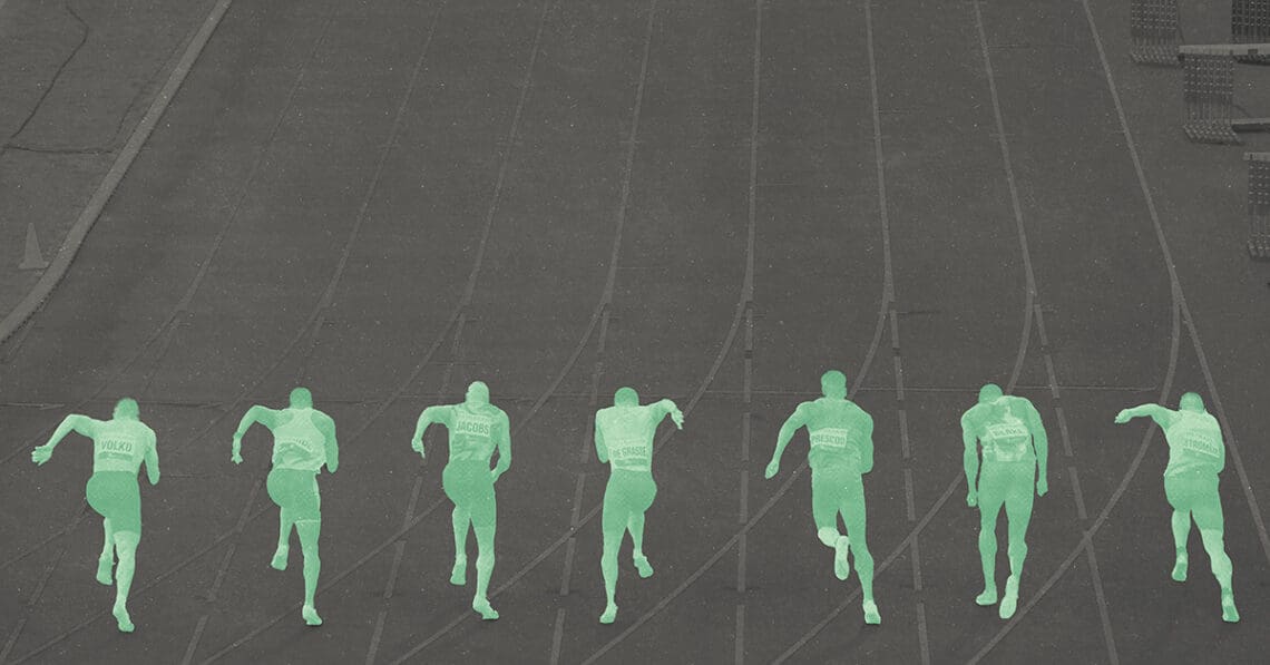 green sprint racers on a track