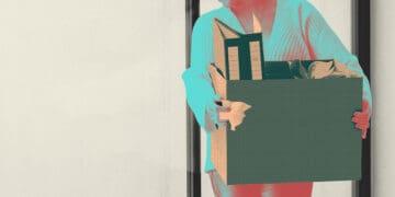 layoffs woman with carton of items