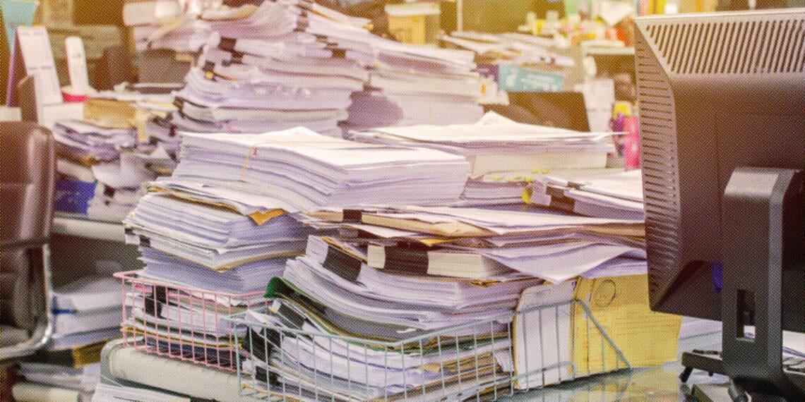 overwhelming stacks of documents