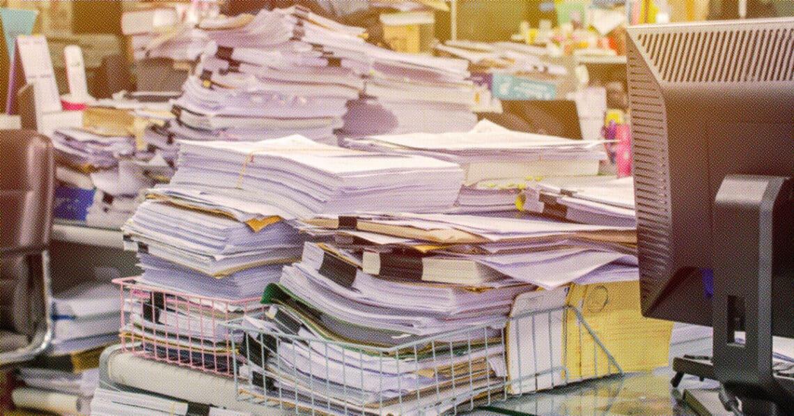 overwhelming stacks of documents
