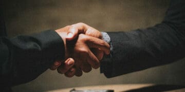 business handshake outsourcing concept