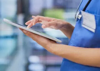 nurse holding chart