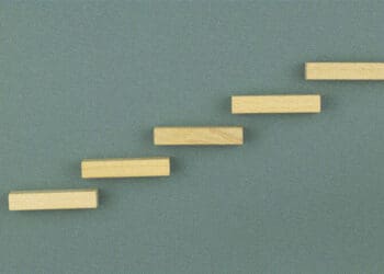 5 wooden steps on a wall