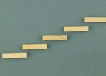 5 wooden steps on a wall