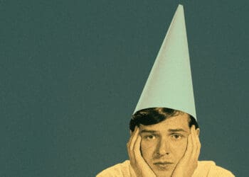 person wearing dunce cap