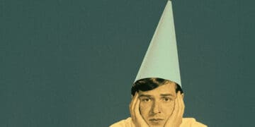 person wearing dunce cap