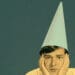 person wearing dunce cap