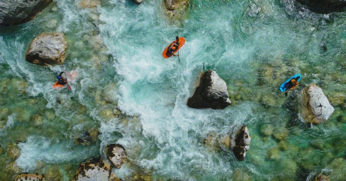 kayakers navigating treacherous waters