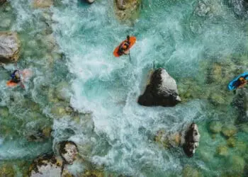 kayakers navigating treacherous waters