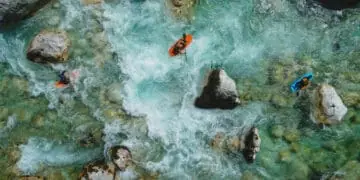 kayakers navigating treacherous waters