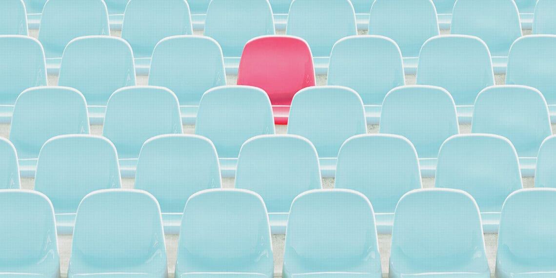 red seat amid blue seats