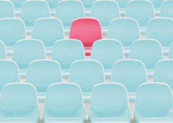red seat amid blue seats