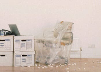 office chair wrapped and boxes on floor