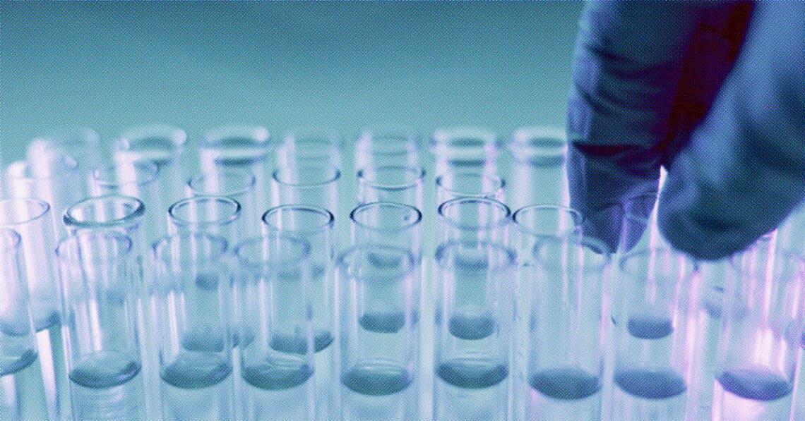 technician working with test tubes in lab