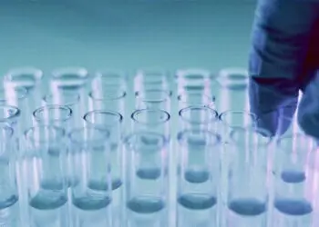 technician working with test tubes in lab