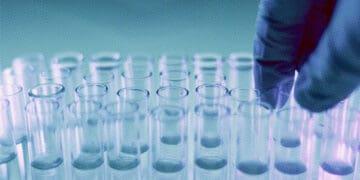 technician working with test tubes in lab