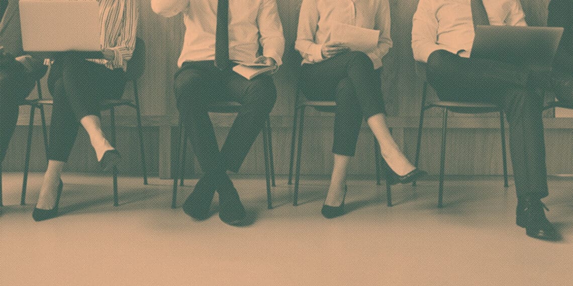 job seekers waiting for interviews in chairs