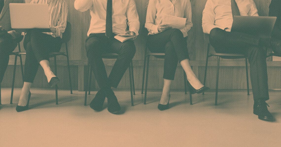 job seekers waiting for interviews in chairs