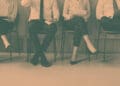 job seekers waiting for interviews in chairs