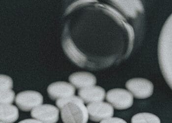 medications spilling from bottle