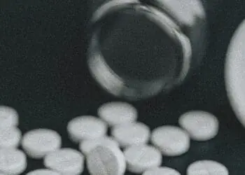 medications spilling from bottle